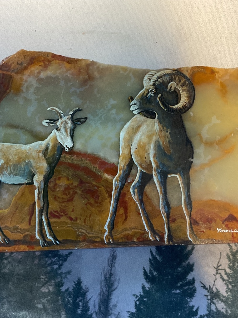 Desert rams painted on onyx